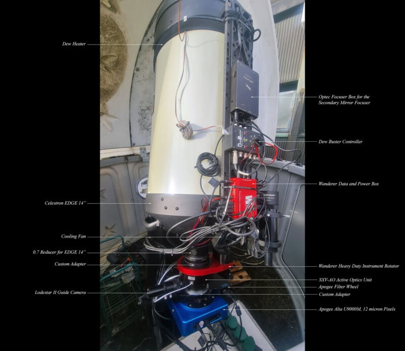 Close-up image of a telescope setup in an observatory. Various components are labeled, including the dew heater, Celestron EDGE HD 11", Lodestar X2 Guider Camera, and others like power and control boxes. The device is mounted on a blue base.