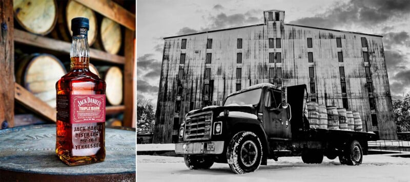  A black and white image of an old truck loaded with barrels parked in front of a large, rustic warehouse in a snowy setting.