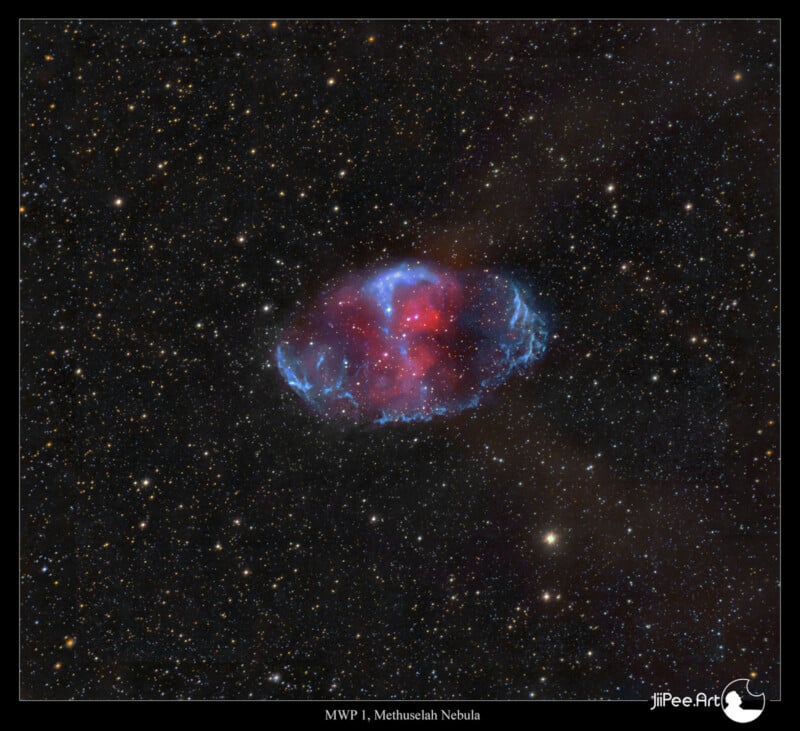 A vibrant image of the Methuselah Nebula, featuring a central red and blue glowing region surrounded by scattered stars against a dark background. The nebula appears as a colorful, fiery ring in space.