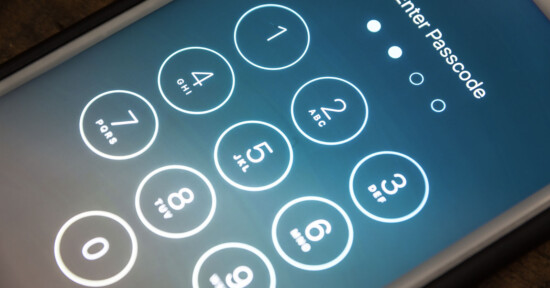 A close-up of a smartphone screen displaying a numeric keypad for entering a passcode. The screen shows numbers 0 to 9, with "Enter Passcode" at the top and four dots indicating passcode length.