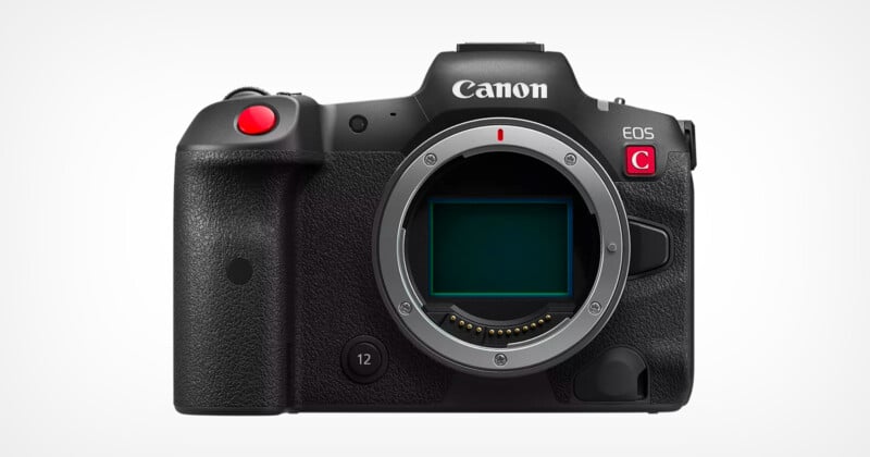 The image shows a Canon EOS camera with a C logo on the front, featuring a prominent lens mount and black body with a textured grip. There's a red button on top, and it's displayed against a plain white background.