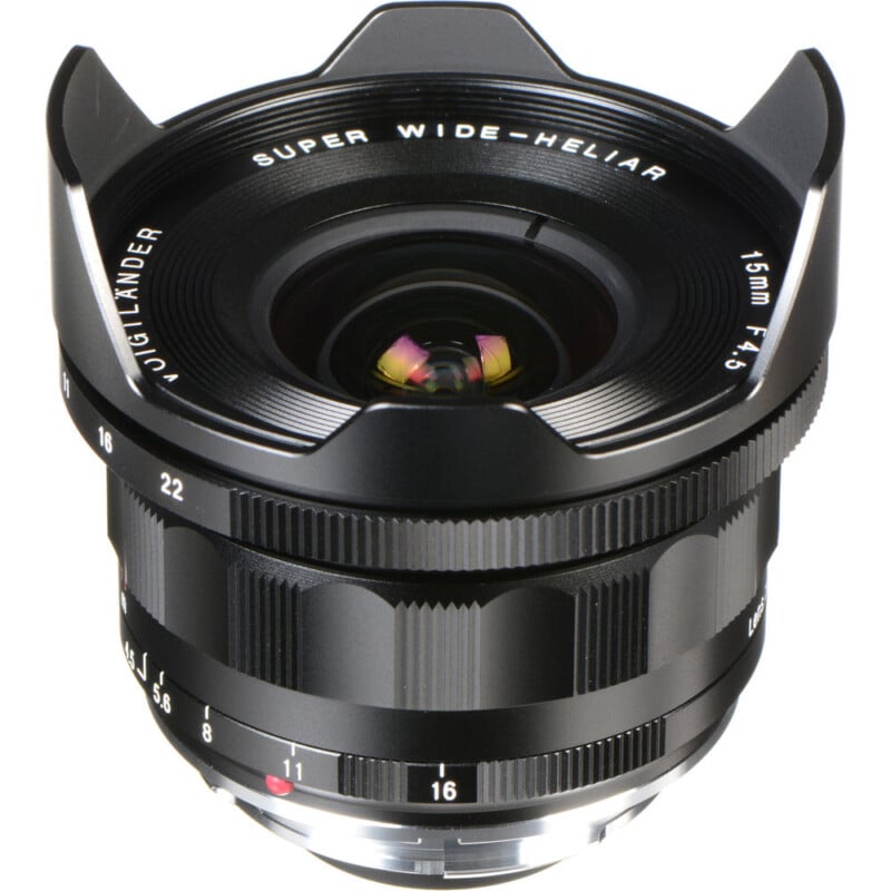 A Voigtlander Super Wide-Heliar 15mm f/4.5 lens with a black metal body. The lens features prominent ridged focus and aperture rings, and the markings are clearly visible on its surface.