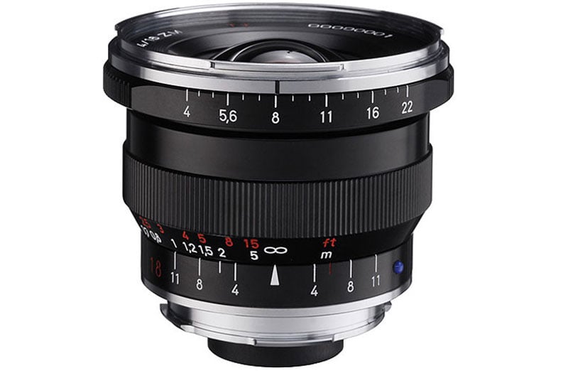 A black and silver camera lens with marked numbers and focus rings, featuring a wide aperture. The lens has a large glass front element and is suitable for capturing high-quality images in various lighting conditions.