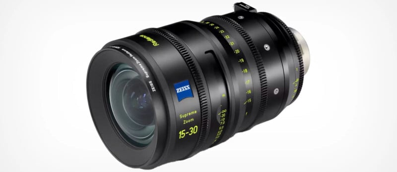 A high-end camera lens with a black body featuring green and white markings for focus and zoom adjustments. The lens has a blue Zeiss logo and is labeled "Supreme 15-30mm." It is designed for professional photography and videography.