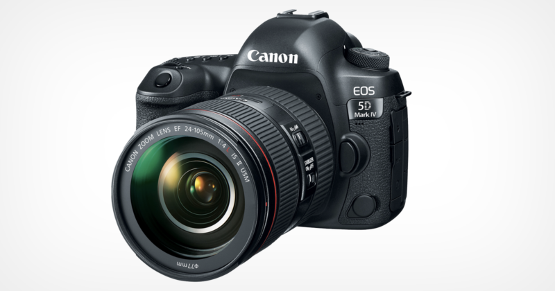 A Canon EOS 5D Mark IV DSLR camera with a 24-105mm lens. The camera is angled slightly to the right, showcasing the lens and body with visible brand and model markings. The background is white.