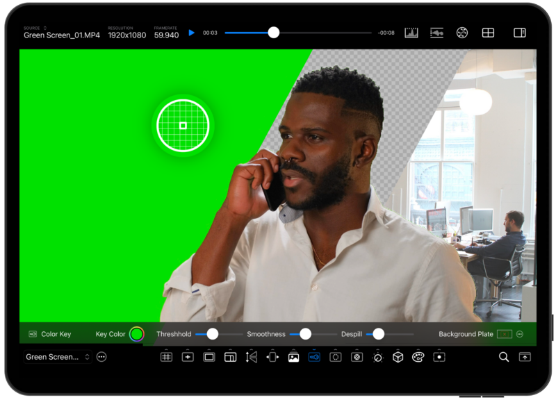 A man in a white shirt talks on the phone in front of a green screen. The image editing software window shows video editing tools and options, with an office scene partially visible in the background.