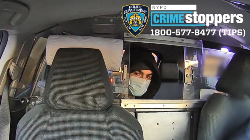 Image of a person in a vehicle, wearing a mask and hood, looking through a partially open partition. There's a Crime Stoppers banner with the NYPD logo and phone number 1800-577-8477 (TIPS) in the upper corner.