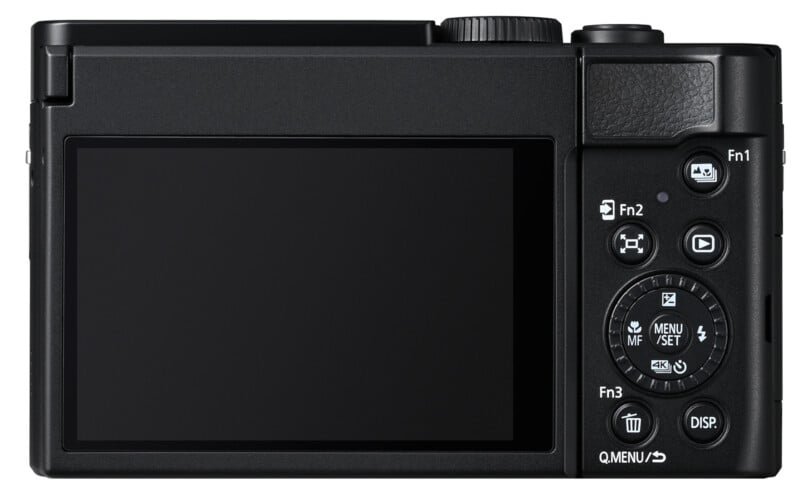 A rear view of a digital camera with a large LCD screen and a variety of control buttons, including mode dials, function buttons, and a delete button, all arranged on the right side of the camera.