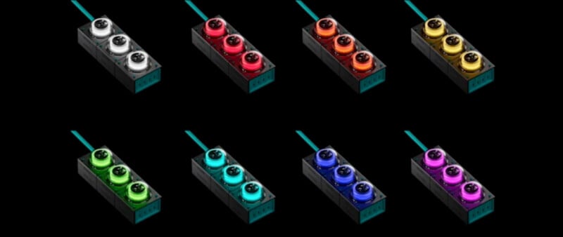  white, black, red, orange, yellow, green, teal, blue, and purple. Each switch is mounted on a rectangular black base with a teal cable.