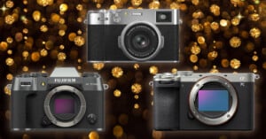 Three digital cameras are displayed against a glittery gold background. The models shown are Fujifilm X-T50, a Sony E-mount, and a Fujifilm rangefinder-style camera, each highlighting features like lenses and controls.