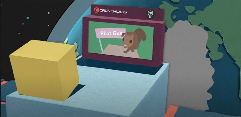 A papercraft-style scene with a screen displaying a cartoon squirrel holding a sign that says "Phat Gus." The scene is part of a setup labeled "Crunchlabs," featuring colorful geometric shapes and a globe.