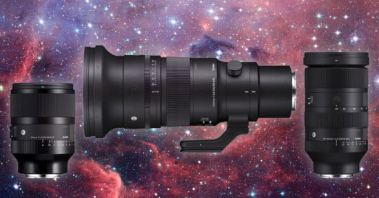 Three camera lenses displayed against a colorful cosmic background. The lenses are positioned with one in the center horizontally and the other two vertically on either side. The starry background enhances the sleek black design of the lenses.