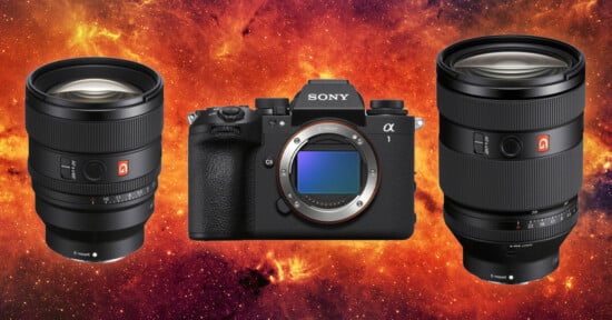 A Sony camera body is flanked by two lenses on a vibrant, fiery orange and red galaxy background. The lenses have wide apertures and are positioned on either side of the camera.