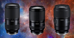 Three Tamron camera lenses are displayed against a vibrant, colorful space background featuring red, blue, and orange nebulae. The lenses vary slightly in size and focal length markings are visible on their barrels.