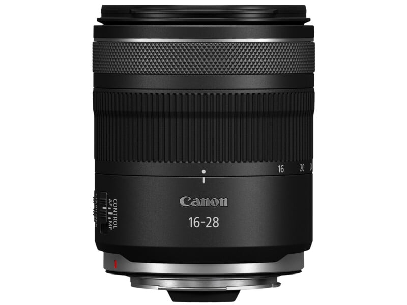 A Canon 16-28 mm camera lens with a sleek black design, featuring zoom and focus rings. The lens has a labeled control ring and markings for focal lengths ranging from 16 to 28 mm. The Canon logo is visible near the top.