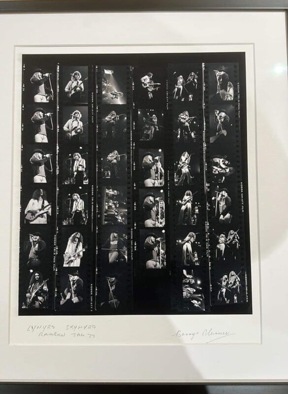 A black and white photo contact sheet featuring a series of small images showing a music band performing live on stage. The frames capture musicians in various poses with instruments. Handwritten notes are visible on the border.