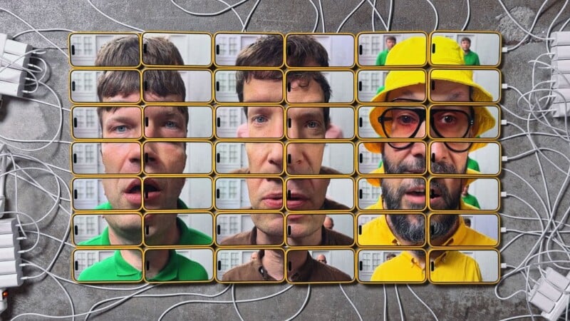 A grid of smartphones displays parts of four different male faces, creating a collage. Each phone shows a distinct facial section. One person wears a yellow hat and glasses. The phones are connected by white cables.