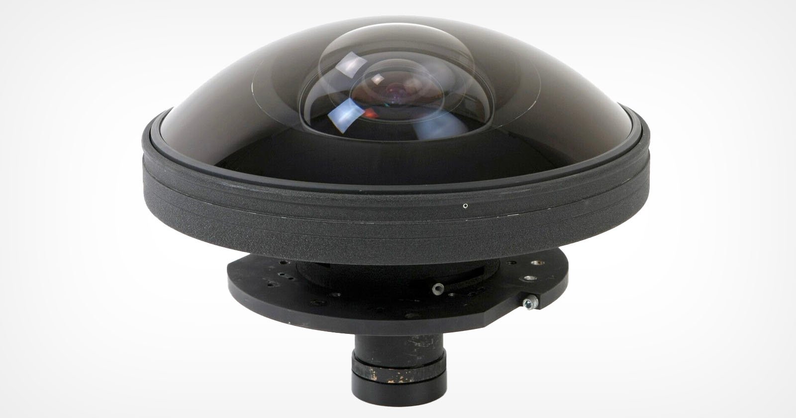 A dome-shaped 360-degree camera lens with a transparent cover on top, mounted on a black circular base and cylindrical support underneath, set against a plain white background.