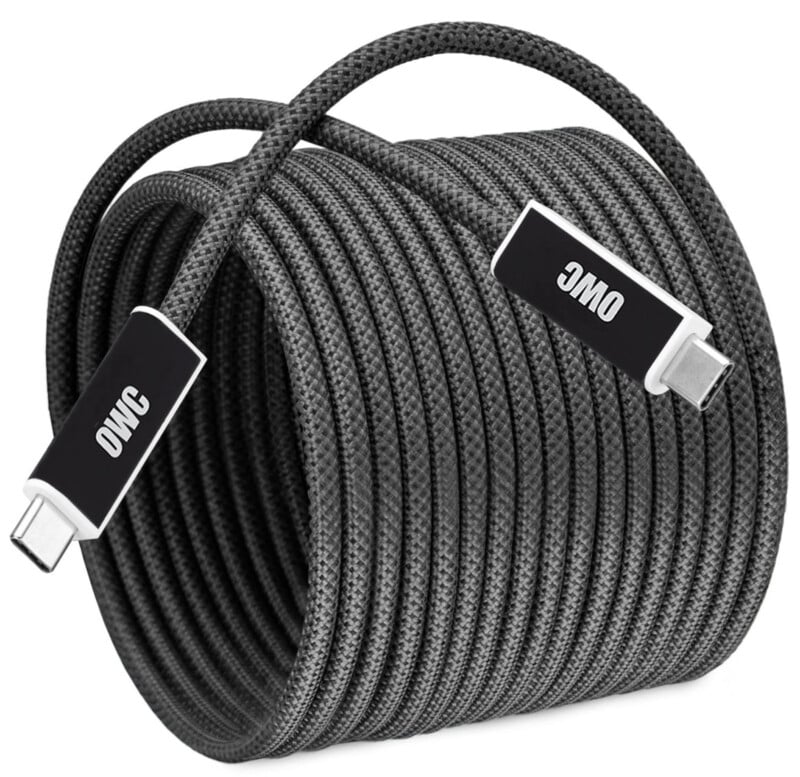 Coiled black braided USB-C cable with silver connectors. The connectors have "OWC" printed in white text.