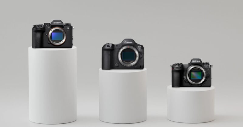  a Sony camera, a Canon camera, and a Nikon camera, each with a visible lens mount and positioned on varying pedestal heights against a neutral background.