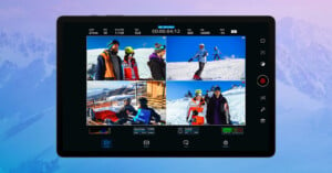 A tablet screen displays a video editing app with four clips of people skiing and snowboarding. The interface shows various controls and a recording timer. The background is a subtle image of snowy mountains.