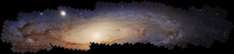 Panoramic image of the Andromeda Galaxy, displaying a detailed view of stars and cosmic dust with a bright central core. The galaxy glows against a dark background, showcasing its spiral structure and expansive celestial presence.