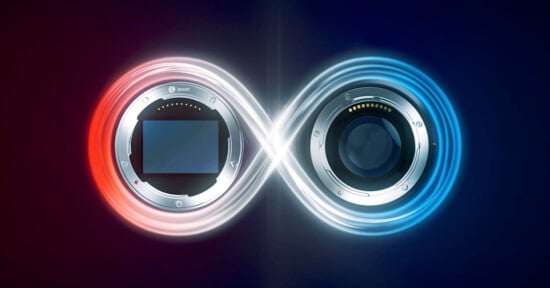 An infinity symbol formed by intersecting red and blue light trails. Within the loops are the front views of two camera lenses, one on each side. The left lens is outlined in red, and the right in blue, against a dark background.