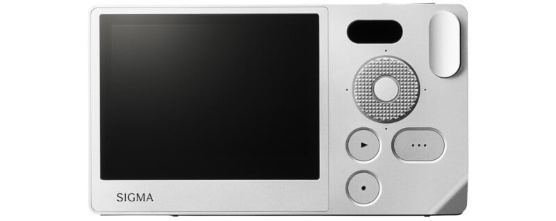 Back view of a silver Sigma camera showing a large LCD screen on the left and various control buttons on the right, including a circular navigation pad, play button, and menu button.