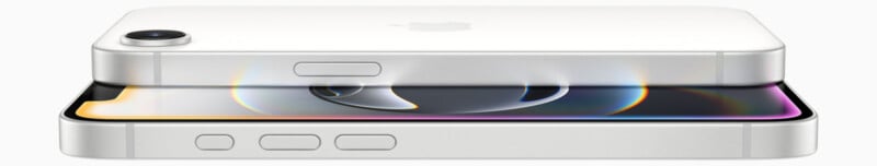 Two white smartphones stacked horizontally. The top phone shows the back with a single rear camera and Apple logo. The bottom phone displays the screen with colorful reflections. Both devices have side buttons and a sleek, modern design.