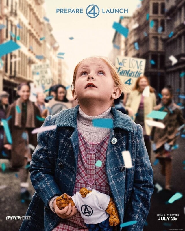 A young girl in a blue coat looks up, holding a Fantastic Four toy. The background features a cheering crowd with signs like "We Love Fantastic 4". Confetti fills the air. Text at the top reads "Prepare 4 Launch" and at the bottom "Only in Theaters July 25".