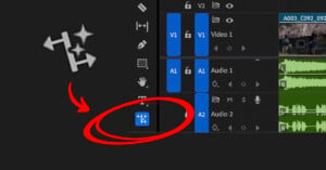 A video editing timeline interface features audio and video tracks. A red circle and arrow highlight an icon resembling a star with arrows. The icon is situated in a row of tools on the timeline.