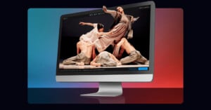 A computer screen displays a dynamic scene of four dancers in flowing outfits. The dancers are artfully posed, conveying movement and grace. The background is a gradient of blue and red hues.