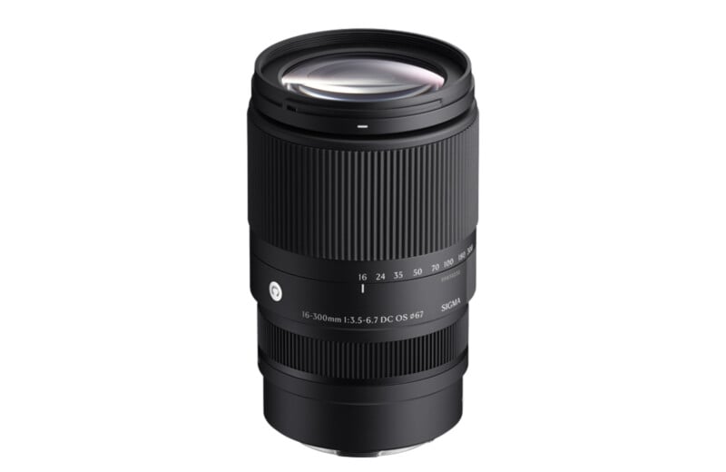 A Sigma camera lens featuring a black body with textured grip, labeled markings on the zoom ring, and specifications reading "16-300mm 1:3.5-6.7 DC OS HSM" printed on the barrel.