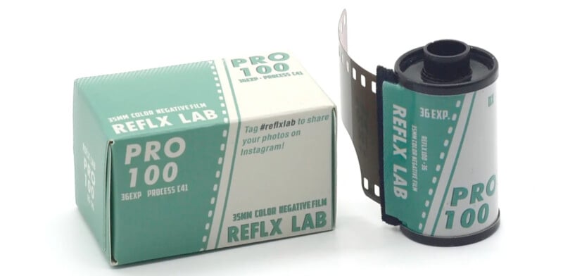 A 35mm film roll labeled "PRO 100" and "REFLX LAB" is next to a matching box. The box is green and white, displaying "36EXP. PROCESS C41" and a social media prompt: "Tag #reflxlab to share your photos on Instagram!.