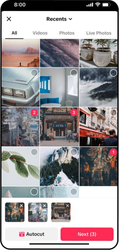 A photo gallery app screen showing a grid of various images, including landscapes, cityscapes, and plants. Some images are selected, indicated by checkmarks. The interface has options for "Autocut" and "Next" at the bottom.