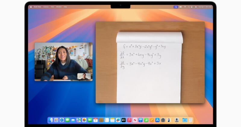 A laptop screen displays a video call. Two people are visible in a small window on the left. The main view shows math equations written on a notepad. The desktop has several application icons at the bottom.