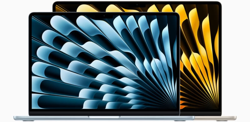 Two laptops with screens displaying abstract spiral patterns. The front laptop shows a pattern in shades of blue, while the back one displays a similar design in shades of gold. Both devices have sleek, modern designs.