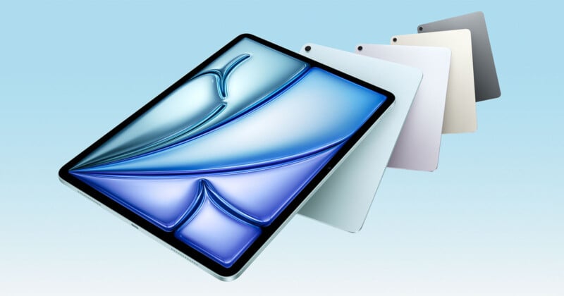 A sleek tablet with a vibrant blue screen is displayed at an angle. Behind it, four more tablets fan out, featuring colors in shades of white, gray, and cream against a light blue background.