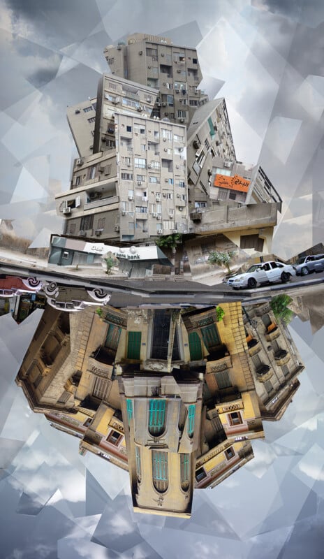A surreal composite image of a cityscape featuring apartment buildings stacked in a distorted manner. The scene includes a street with a parked car. The top and bottom halves of the image mirror each other, creating an abstract, rotated perspective.