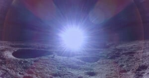 A bright light source creates a lens flare effect over a rocky, cratered surface, resembling a lunar landscape. The light radiates in all directions, dominating the sky and casting shadows across the terrain.