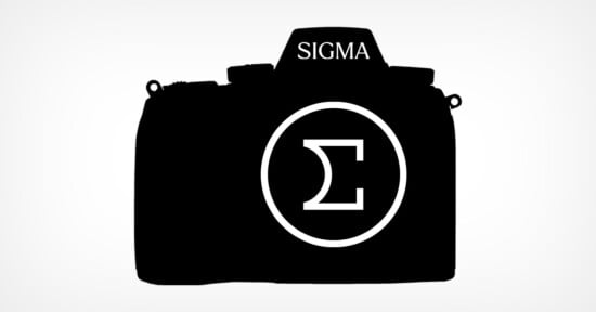 Silhouette of a camera with the logo "Sigma" on the top and a large Greek sigma symbol inside a circle on the body.