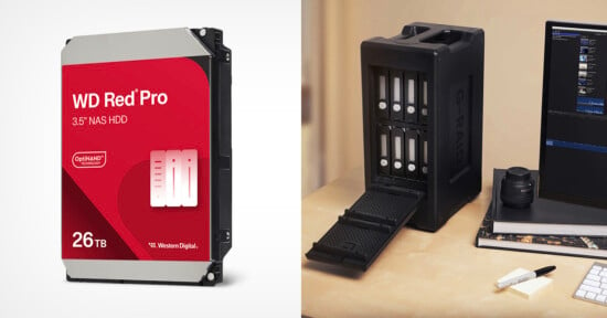 On the left, a WD Red Pro 3.5" NAS HDD with 26TB storage capacity. On the right, a black G-RAID storage device with open slots, placed on a desk next to a camera lens, pen, notebook, and a computer monitor.