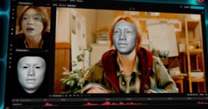 A computer screen showing facial recognition software applied to a video of a person with long hair. The image displays a 3D mask overlay on the person's face, with graphics and timelines below the video for editing.