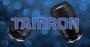 Two Tamron camera lenses on a blue bokeh background, with the word "Tamron" in bold, large letters across the center.