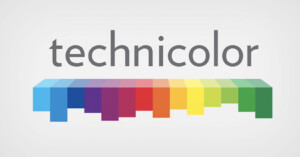 Technicolor logo with the word "technicolor" in gray above a horizontal row of overlapping colored rectangles ranging from blue to green, yellow, red, and purple, set against a white background.