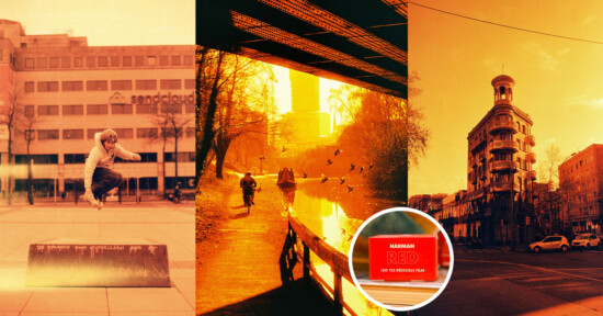 A triptych image with a skateboarder mid-jump in front of a building, people walking by a canal under a bridge with birds flying, and a historic tall building. The entire image has a red-orange filter with an inset of the "HARIMAN RED ISO 50" film branding.