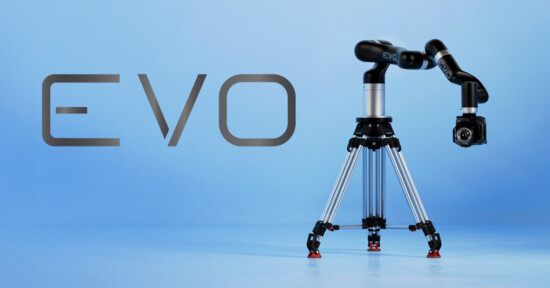 A black robotic camera arm labeled "EVO" is mounted on a silver tripod against a light blue background. To the left, "EVO" is written in large letters.