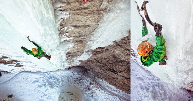 A person wearing a green jacket and orange helmet climbs a steep, icy rock face using ice axes, with snow and rugged cliffs below. The climber is seen from above, highlighting the height and intensity of the ascent.