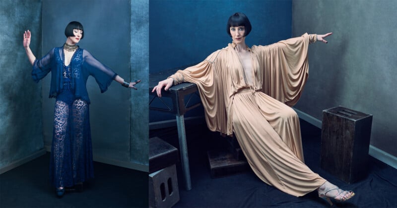 Two women with short dark bobs and pale skin pose in dramatic vintage-inspired outfits: one stands in sheer blue lace, the other sits in a flowing beige gown with wide sleeves, both against textured blue-gray backdrops.