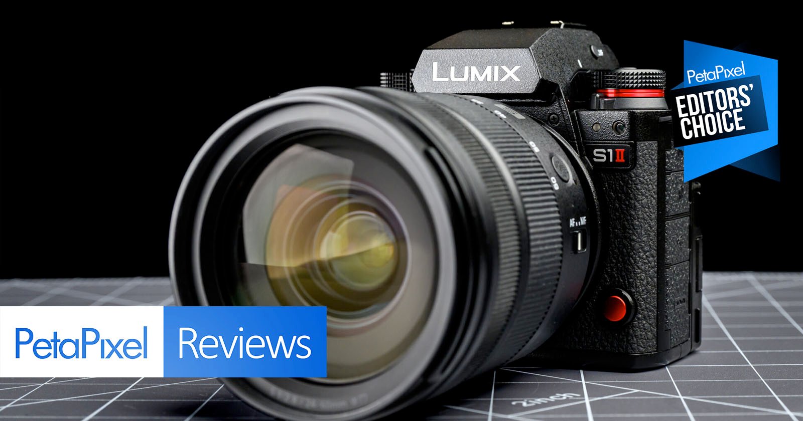 A close-up of a Panasonic Lumix S1 II camera on a grid-patterned surface, with "PetaPixel Reviews" and "Editors' Choice" labels overlaid on the image.